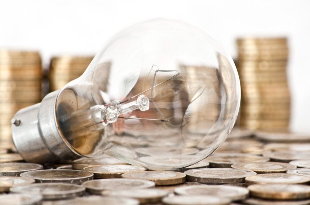 csm filament bulb lying on euro coins 3f7d789bf3