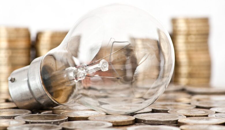 csm filament bulb lying on euro coins 3f7d789bf3